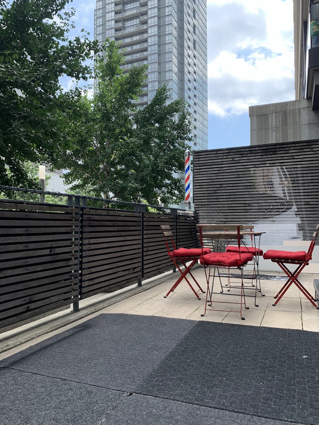 Outdoor patio area near Ako Barbershop