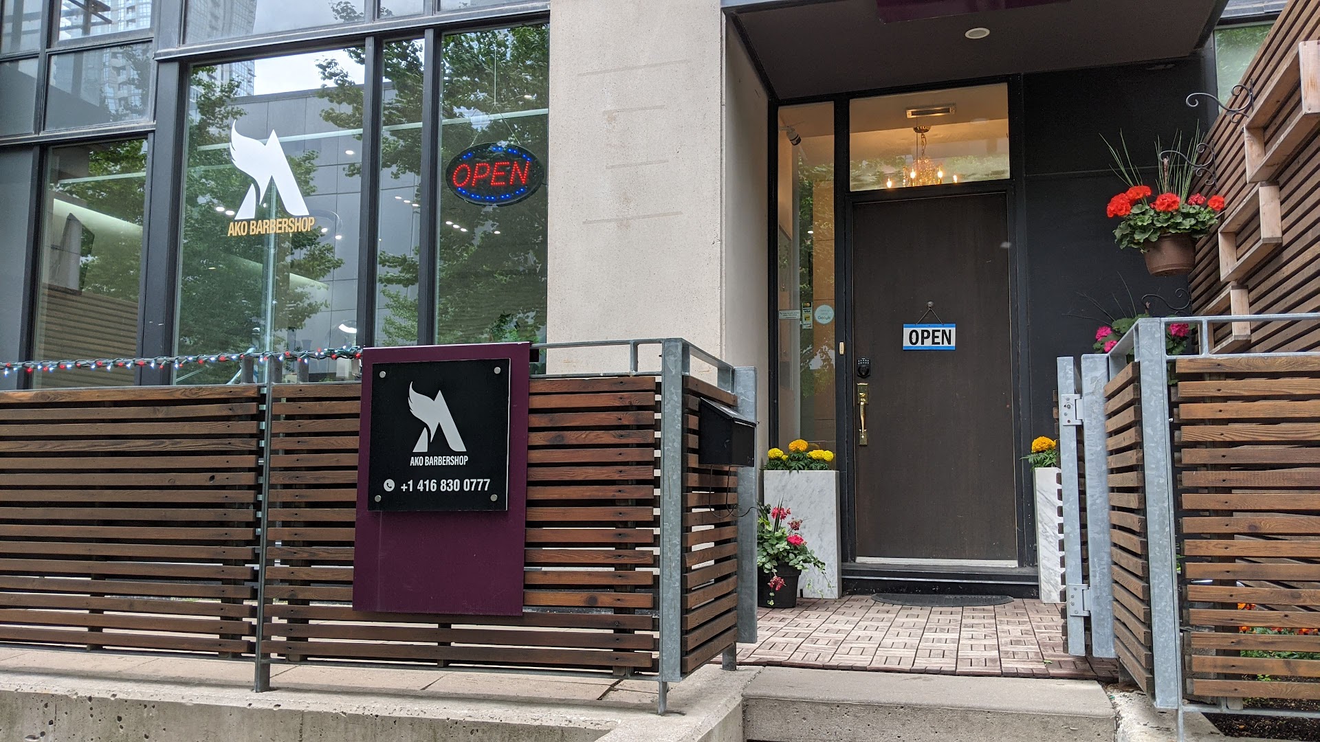 Ako Barbershop storefront at 12 Telegram Mews, Toronto