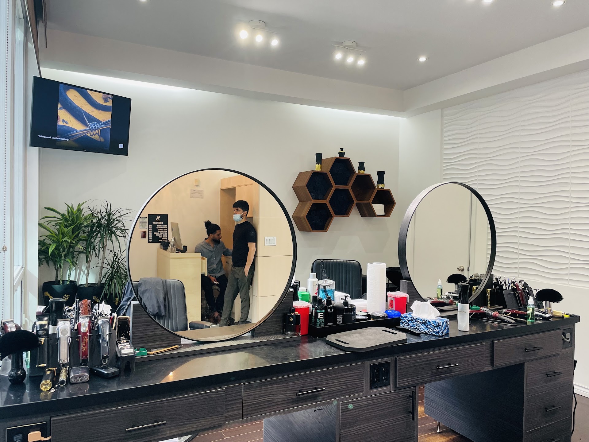 Barber workstation with tools and products at Ako Barbershop